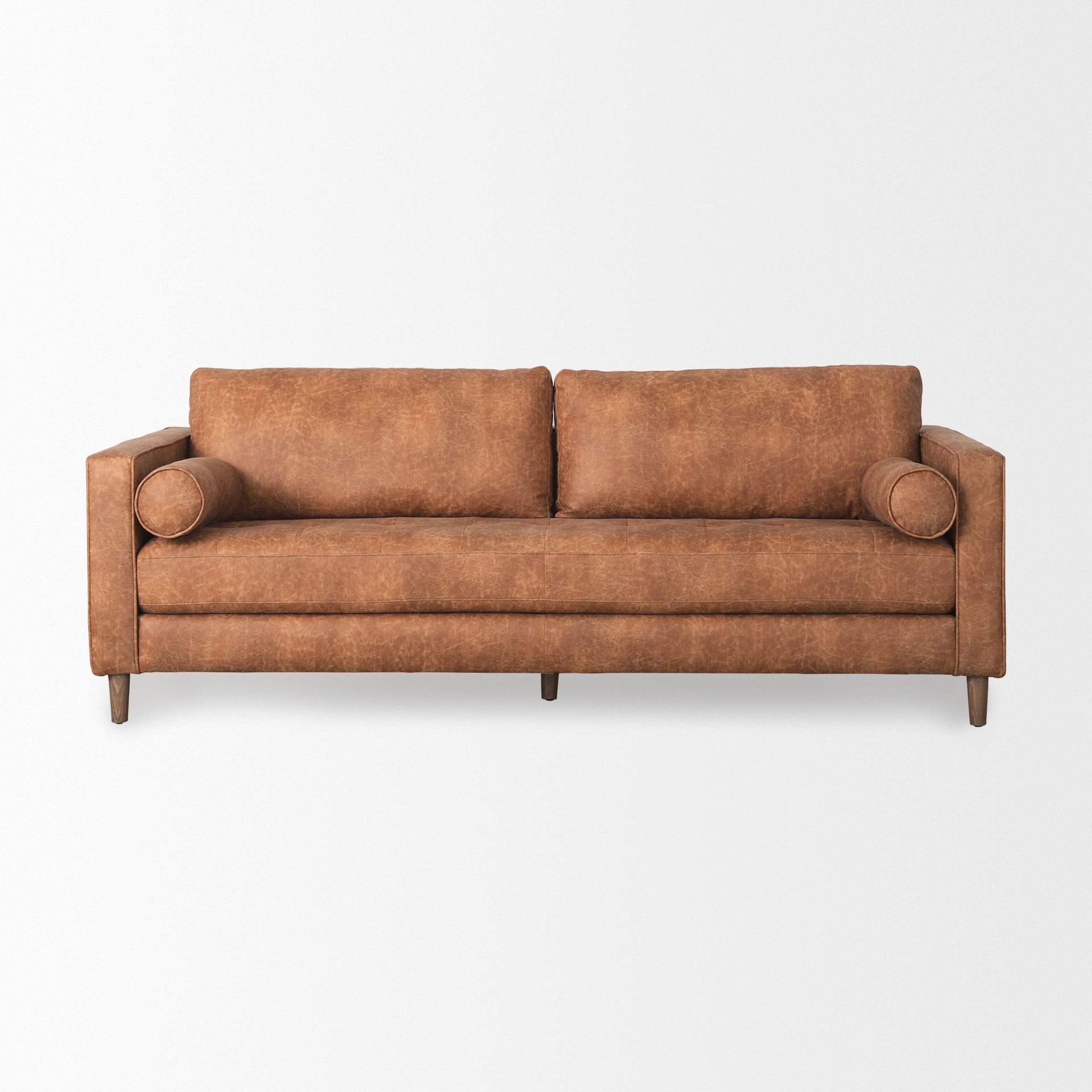 Loretta 88.0L x 36.2W x 33.9H Cognac Brown Faux Leather Three Seater Sofa with Two Bolster Cushions