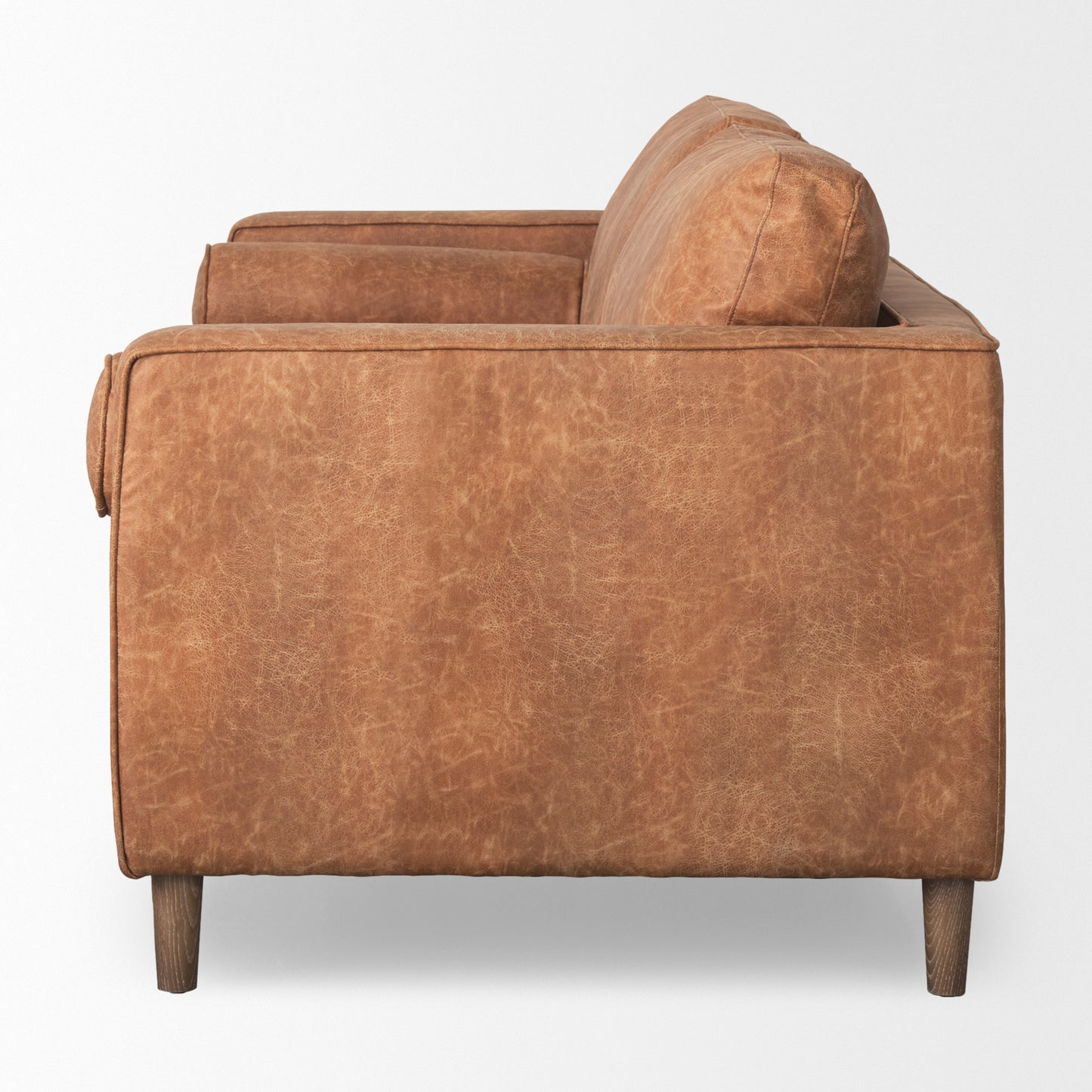 Loretta 88.0L x 36.2W x 33.9H Cognac Brown Faux Leather Three Seater Sofa with Two Bolster Cushions