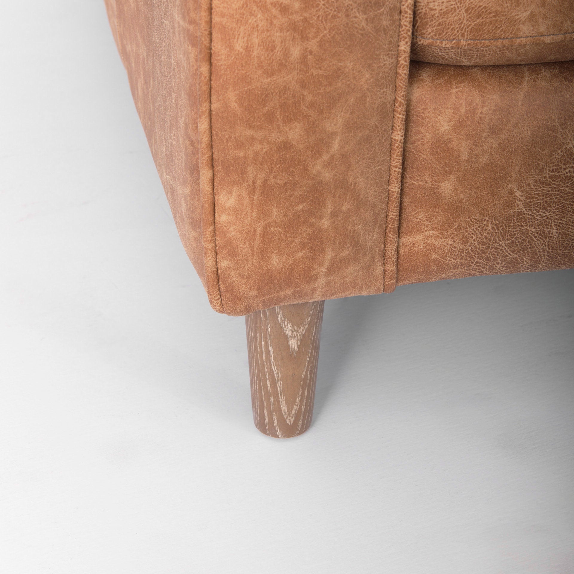 Loretta 88.0L x 36.2W x 33.9H Cognac Brown Faux Leather Three Seater Sofa with Two Bolster Cushions