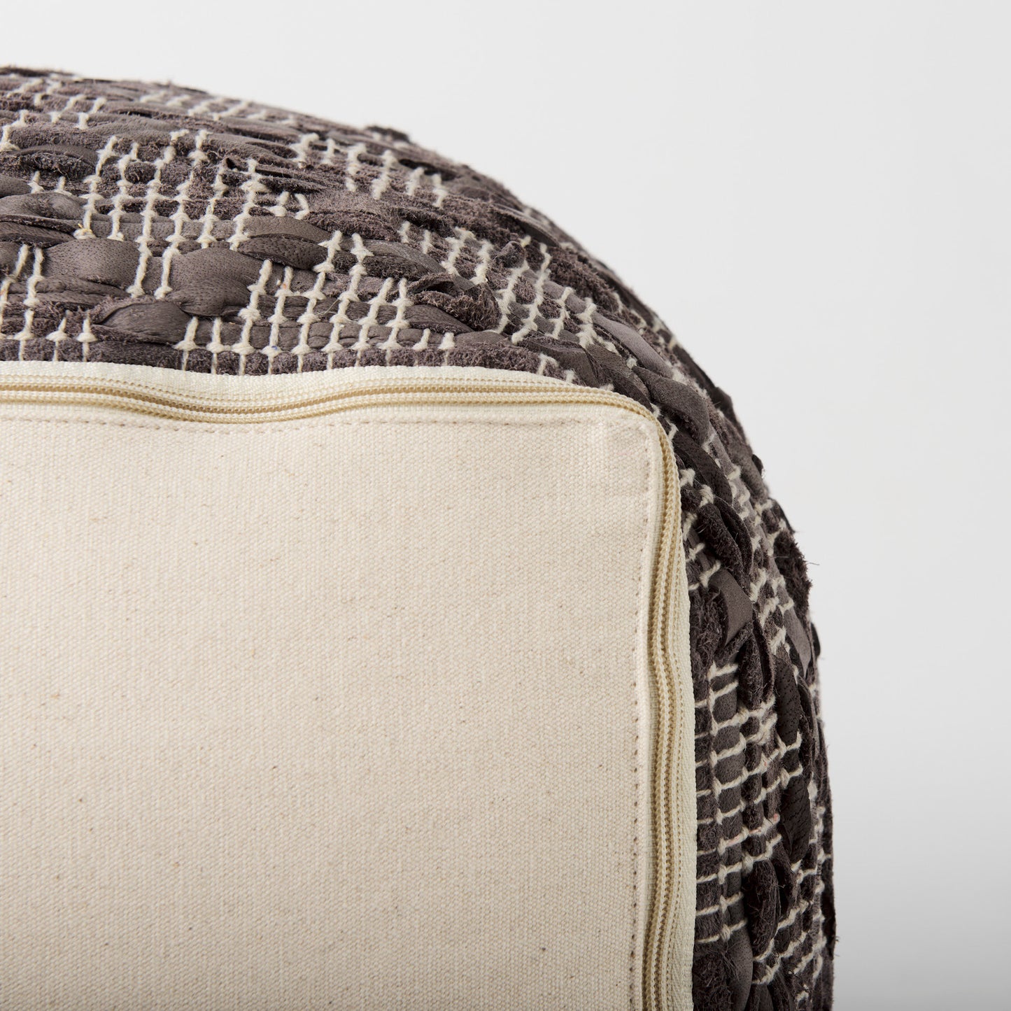Falguni 16.0L x 16.0W x 16.0H Gray Leather and Cotton Patterned Pouf