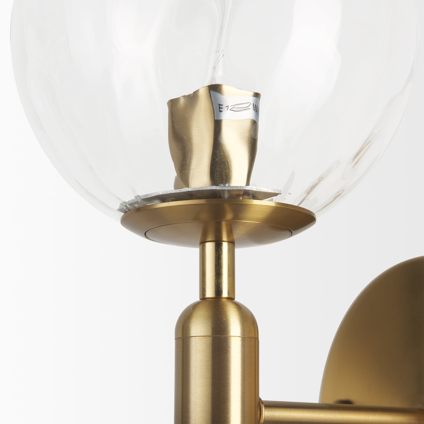 Britton Gold Metal w/ Clear Glass Globe 1-Light Wall Sconce